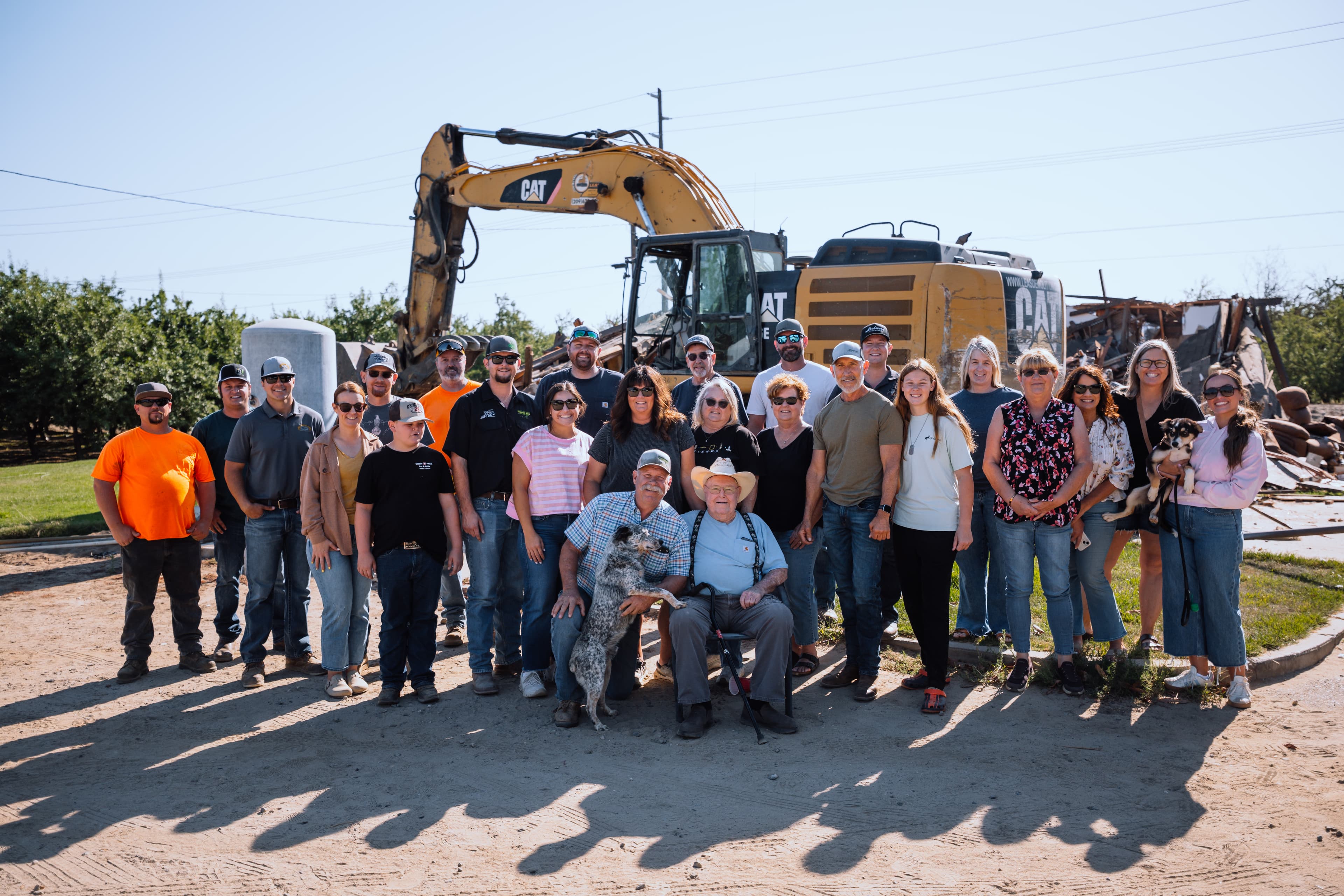 The CG Construction team gathered on a job site